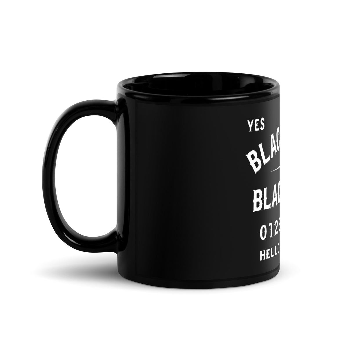 Left side view of black ceramic mug with funny spirit board theme and the words Black Coffee And Black Magic in a gothic font