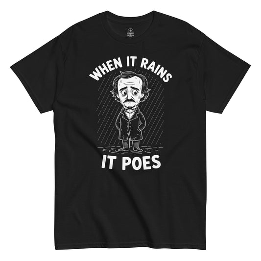 When It Rains It Poes T-shirt featuring cartoon Edgar Allan Poe standing in the rain with white text, white print on black background.