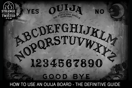 Ouija board with a planchette on a dark table, used in a guide on how to use an Ouija board. By Strange & Twisted