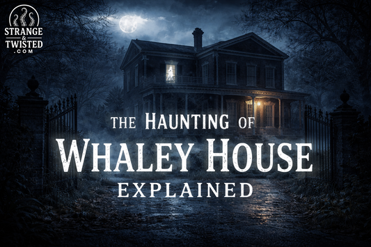 The haunted Whaley House at night with a ghostly figure in the window.