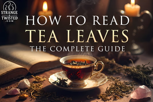 How to Read Tea Leaves The Complete Guide - Beautiful hero image showing a teacup with tea leaves, steaming tea, crystals and divination tools on a mystical table setting