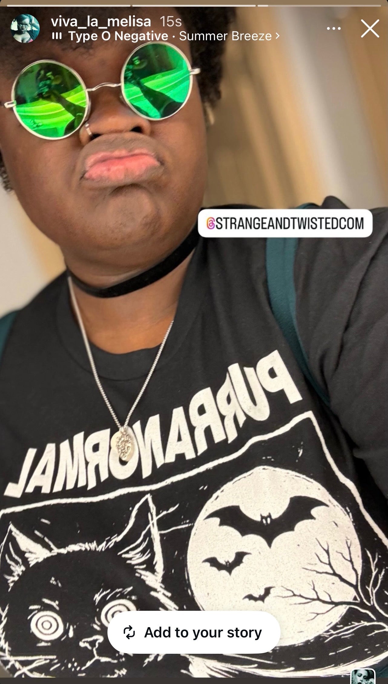 viva_la_melisa content creator and influencer showcasing Strange & Twisted paranormal t-shirt