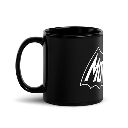 Black Mothman mug featuring retro cryptid artwork with glowing red eyes and spooky lettering