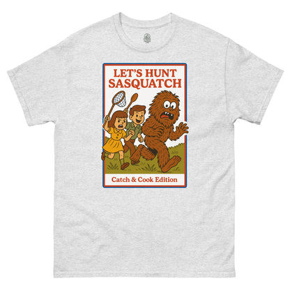 Ash Let’s Hunt Sasquatch Retro Parody T-Shirt front view, funny Bigfoot cartoon cryptid design, By strangeandtwisted.com