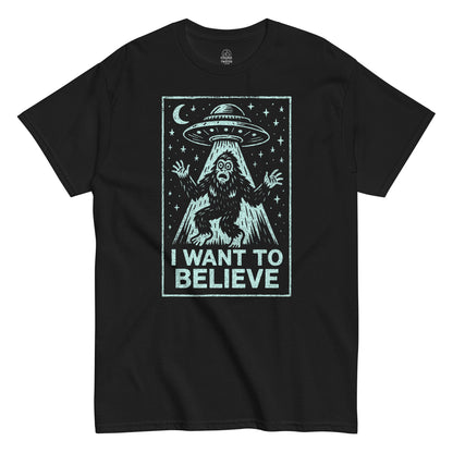 Bigfoot UFO parody T-shirt in black with cryptid and alien spaceship design, I Want To Believe retro style, By strangeandtwisted.com