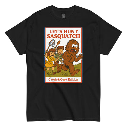 Black Let’s Hunt Sasquatch Retro Parody T-Shirt front view, funny Bigfoot Catch & Cook design, By strangeandtwisted.com