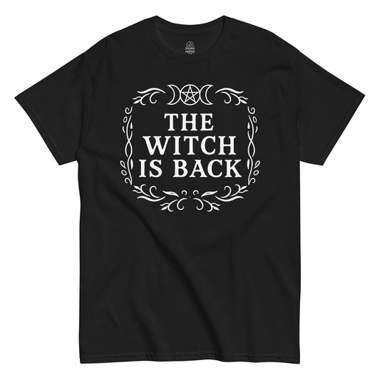 Strange & Twisted black T-shirt with The Witch Is Back gothic design featuring triple moon goddess and ornate border