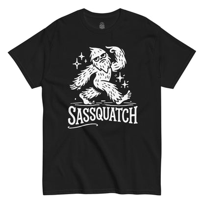 Funny Bigfoot T-shirt on black – cartoon Sassquatch strutting with sparkles and bold “Sassquatch” text