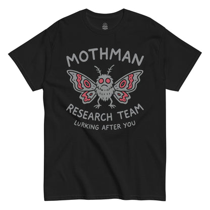 Mothman Research Team T-shirt on black, red-eyed cryptid with “Lurking After You” text for cryptid and folklore fans