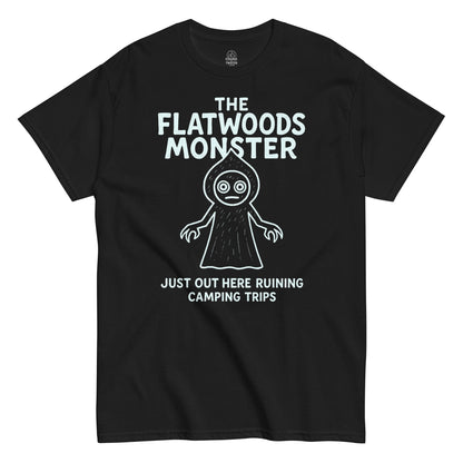Black Flatwoods Monster T-shirt featuring funny cryptid art and slogan “Just Out Here Ruining Camping Trips” by Strange and Twisted