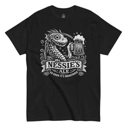 Nessie’s Ale T-shirt featuring cartoon Loch Ness Monster holding beer with text “So Good It’s Monstrous,” white print on black fabric.