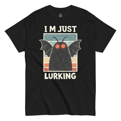 Dark Mothman figure with glowing red eyes and wide wings, Im Just Lurking slogan, vintage cryptid artwork on a black t shirt
