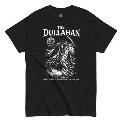 White distressed illustration of the Dullahan headless horseman riding through darkness with warning text, Irish folklore horror artwork on a black t shirt