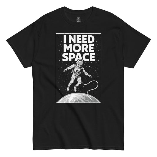 Front black t-shirt showing I Need More Space astronaut floating in space graphic