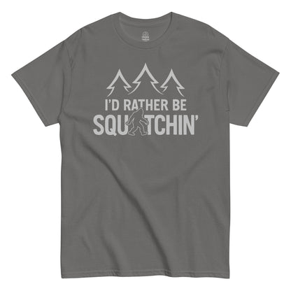 I’d Rather Be Squatchin Bigfoot T-shirt on charcoal grey, funny cryptid graphic for Sasquatch fans