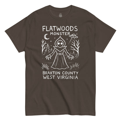 Flatwoods Monster cryptid T-shirt featuring eerie forest UFO scene on brown fabric.