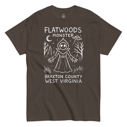 Flatwoods Monster cryptid T-shirt featuring eerie forest UFO scene on brown fabric.