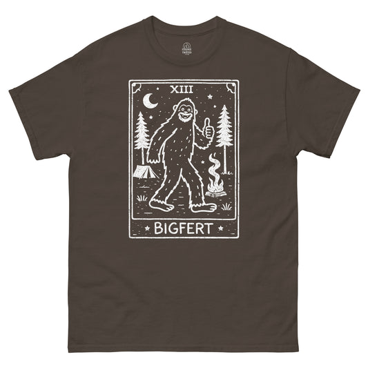 Brown t-shirt with a graphic of a Bigfoot-like creature and 'BIGFERT' text on a white background