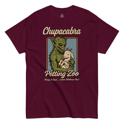 Chupacabra Petting Zoo T-shirt, cryptid holding a goat with funny slogan, stressed vintage design on maroon red tee