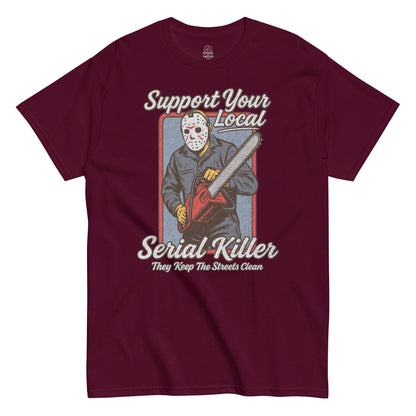 Support Your Local Serial Killer T-shirt, masked slasher with chainsaw, distressed retro horror design on maroon red tee