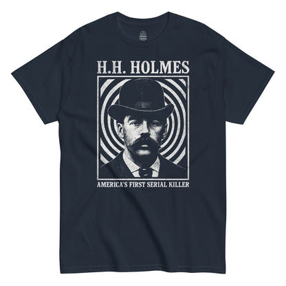 Retro true crime T-shirt in navy with H.H. Holmes portrait and bold America’s First Serial Killer design, Strange and Twisted Apparel