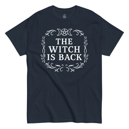 Strange And Twisted navy T-shirt showing The Witch Is Back occult design with pentagram and mystical border pattern