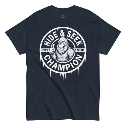 Funny Bigfoot Hide And Seek Champion thumbs-up T-shirt on navy, sasquatch cryptid design