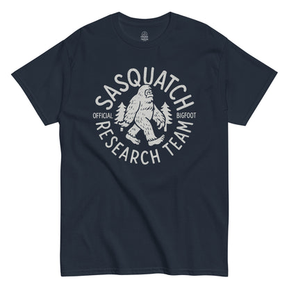 Sasquatch Research Team T-shirt with white cryptid design printed on navy fabric.
