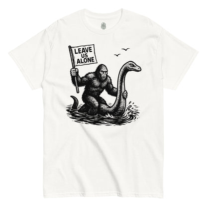 Bigfoot riding Loch Ness Monster T-shirt on white – Bigfoot with “Leave Us Alone” flag riding Nessie