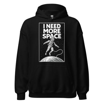 Front black hoodie showing I Need More Space astronaut graphic