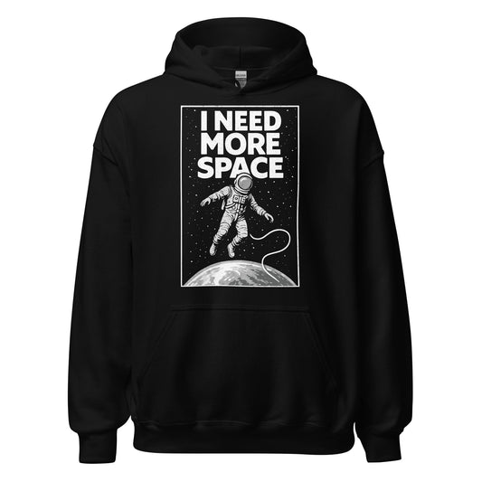 Front black hoodie showing I Need More Space astronaut graphic