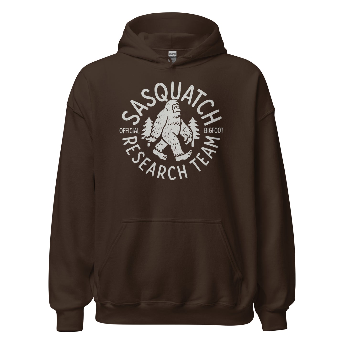 Dark chocolate brown hoodie with Sasquatch Research Team emblem in light grey, Bigfoot walking between trees, circular cryptid badge, By Strange & Twisted