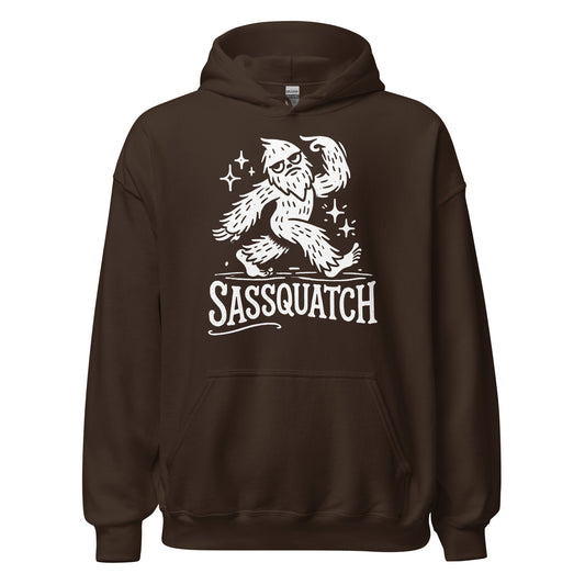 Dark chocolate hoodie featuring a bold white Sasquatch cartoon with sparkles and distressed Sassquatch text.