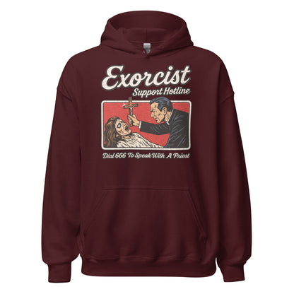 Front of maroon hoodie featuring distressed exorcist hotline scene with retro horror theme. By Strange & Twisted.