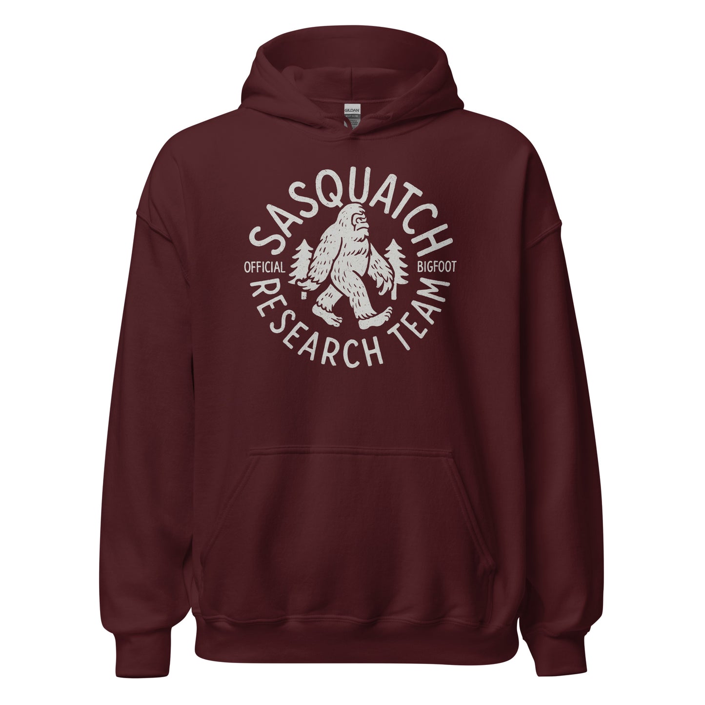 Maroon hoodie featuring Sasquatch Research Team cryptid logo in light grey, Bigfoot and trees inside circular badge, By Strange & Twisted