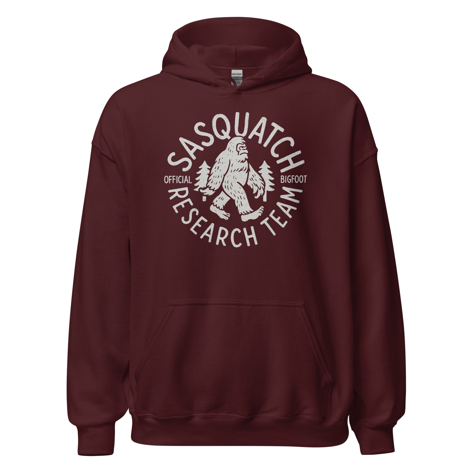 Maroon hoodie featuring Sasquatch Research Team cryptid logo in light grey, Bigfoot and trees inside circular badge, By Strange & Twisted
